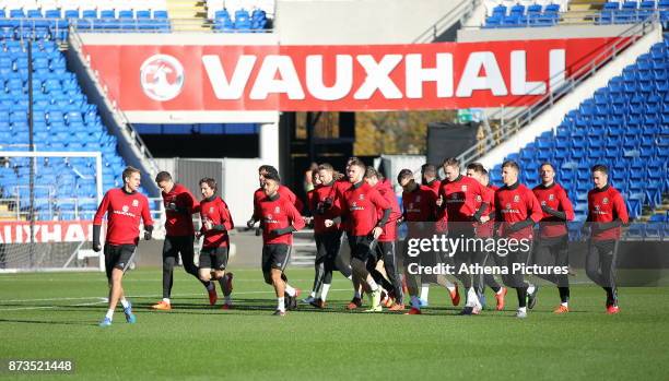 Players warm up during the Wales Press Conference and Training Session at The Cardiff City Stadium on November 13, 2017 in Cardiff, Wales.