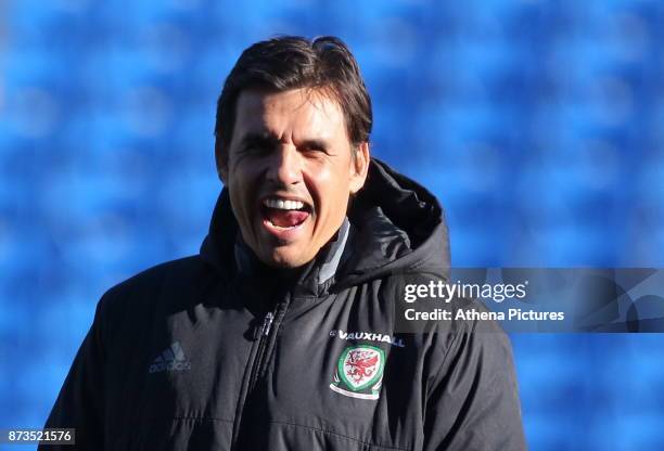 Manager Chris Coleman watches his players train during the Wales Press Conference and Training Session at The Cardiff City Stadium on November 13,...