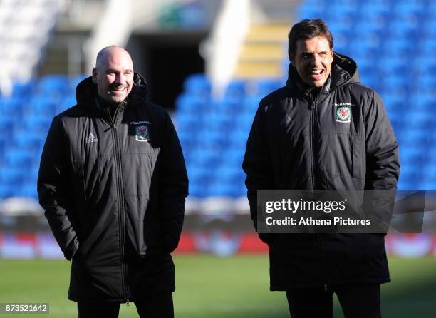 Team psychologist Dr Ian Mitchell and Manager Chris Coleman watch the players train during the Wales Press Conference and Training Session at The...