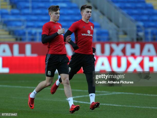 David Brooks and Ben Woodburn warm up during the Wales Press Conference and Training Session at The Cardiff City Stadium on November 13, 2017 in...