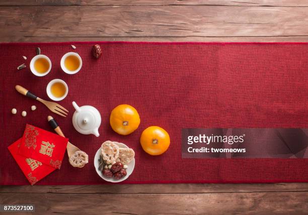 chinese new year food and drink still life. - table mat stock pictures, royalty-free photos & images