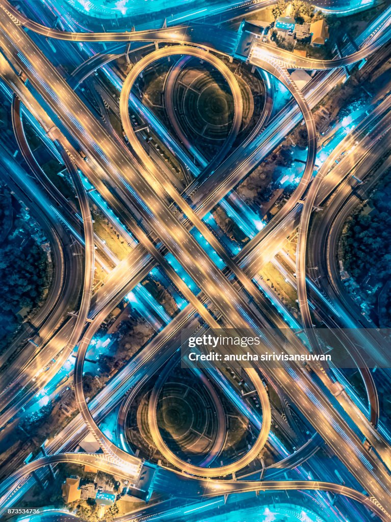 Road beautiful Aerial View of Busy Intersection at Night , top view , thailand .