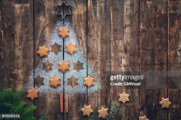 christmas tree with star cookies on rustic background - flour christmas stock pictures, royalty-free photos & images