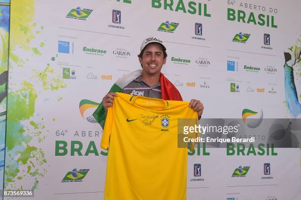 Rodolfo Cazaubon of Mexico hold a t-shirt signed by Pele during the final round of the PGA TOUR Latinoamerica 64 Aberto do Brasil at the Olympic Golf...