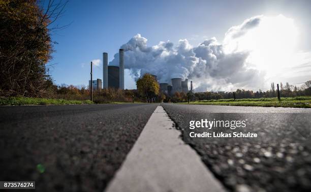 Steam rises from the Niederaussem coal-fired power plant operated by German utility RWE, which stands near open-pit coal mines that feed it with...