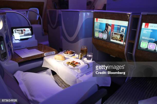 Meal sits on a table in the business class cabin of an Airbus SE A380-800 passenger aircraft, operated by Emirates Airlines, during the 15th Dubai...