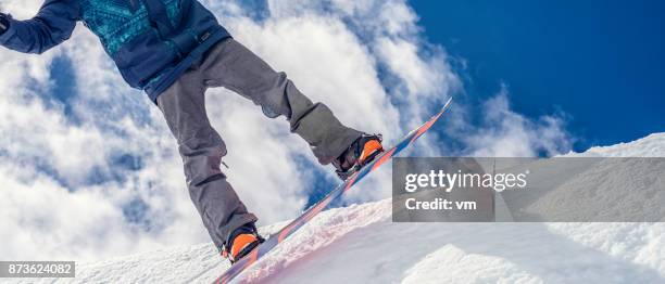 close up of snowboarder taking off in a half pipe - snowboard jump close up stock pictures, royalty-free photos & images