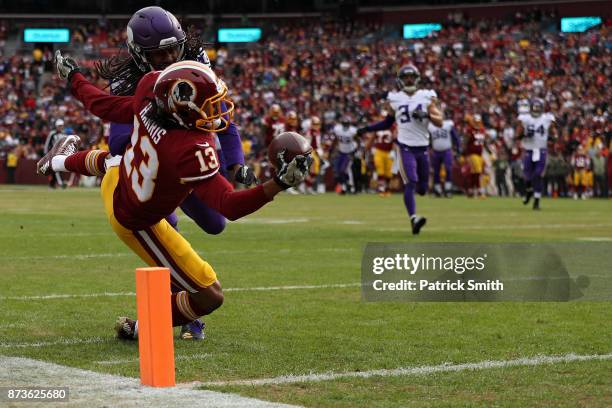 Wide receiver Maurice Harris of the Washington Redskins catches a touchdown pass in front of cornerback Trae Waynes of the Minnesota Vikings during...