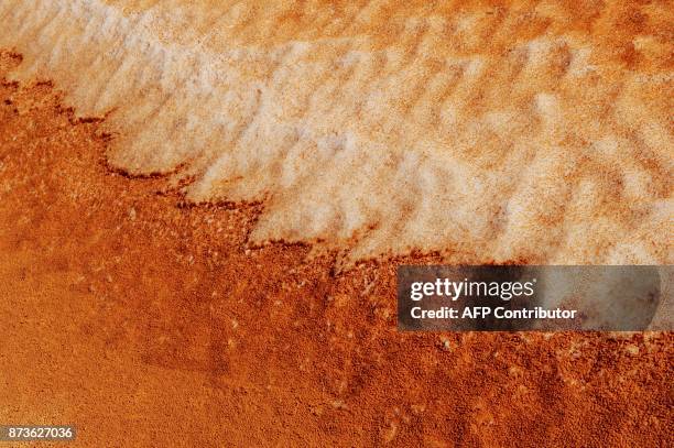 View of snow on a sand dune at the Coral Pink Sand Dunes State Park in Utah on March 11, 2011. Coral Pink Sand Dunes State Park encompasses 3,730...