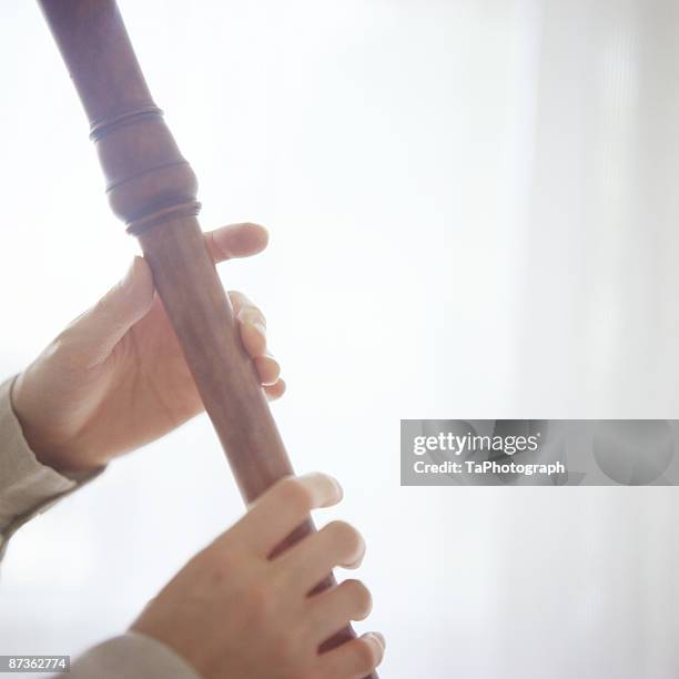 female recorder player - recorder stock pictures, royalty-free photos & images