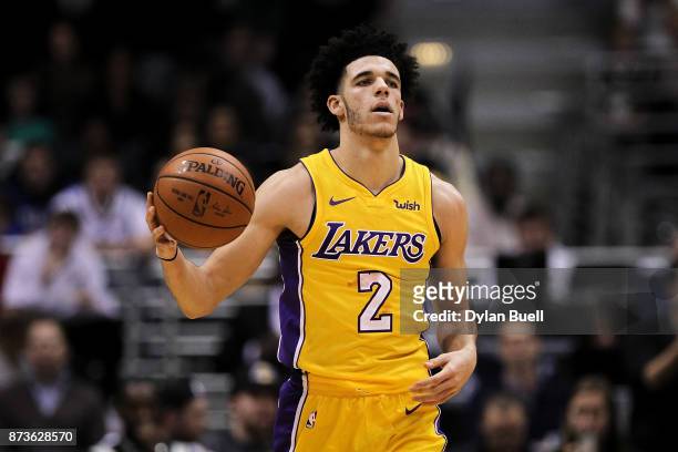Lonzo Ball of the Los Angeles Lakers dribbles the ball in the third quarter against the Milwaukee Bucks at the Bradley Center on November 11, 2017 in...