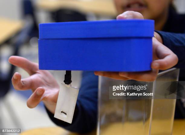 Gitanjali Rao shows her "Tethys" device at the STEM School Highlands Ranch on November 7, 2017 in Highlands Ranch, Colorado. Inspired by the Flint,...
