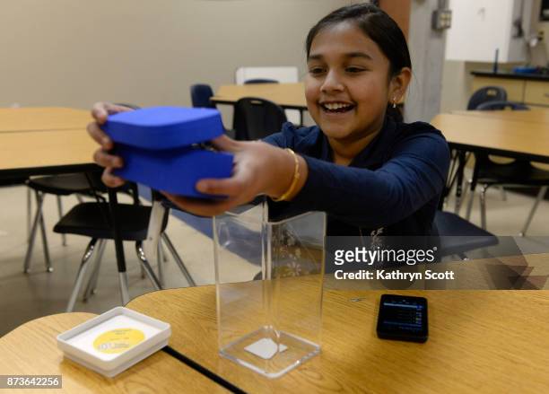Gitanjali Rao shows her "Tethys" device at the STEM School Highlands Ranch on November 7, 2017 in Highlands Ranch, Colorado. Inspired by the Flint,...