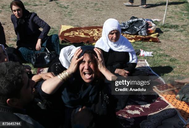 Earthquake survivors who had lost their relatives cry at Sarpol-e Zahab province of Kermanshah, Iran on November 13, 2017 following a 7.3 magnitude...