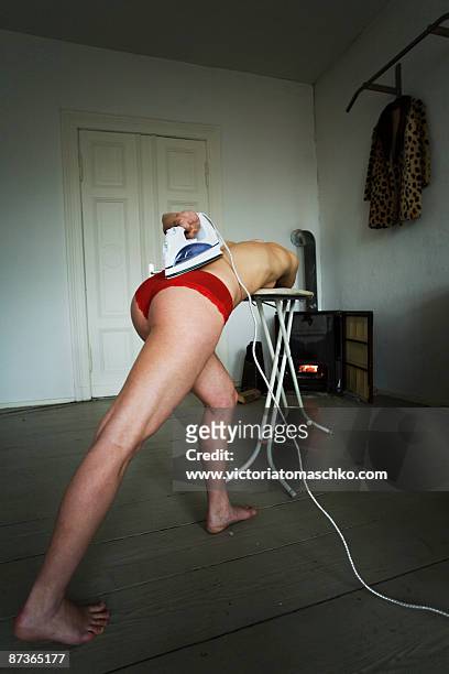 woman with electric iron - iron appliance stockfoto's en -beelden