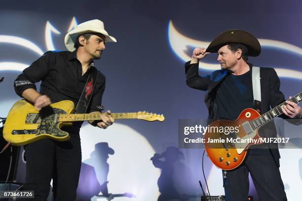 Brad Paisley and Michael J. Fox perform on stage at A Funny Thing Happened On The Way To Cure Parkinson's benefitting The Michael J. Fox Foundation...