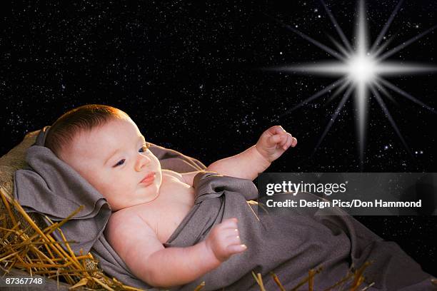 baby jesus in a manger - design pics don hammond stock-fotos und bilder