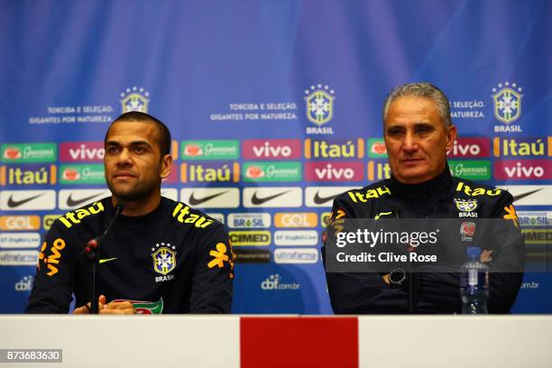 Dani Alves of Brazil and Tite, Manager of Brazil speak during a Brazil Press Conference ahead of the International Friendly Match between England and...