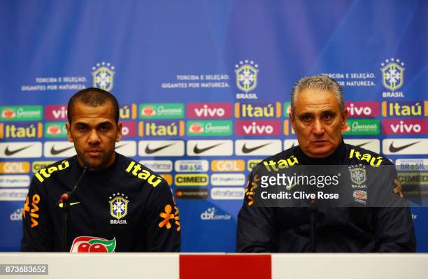 Dani Alves of Brazil and Tite, Manager of Brazil speak during a Brazil Press Conference ahead of the International Friendly Match between England and...