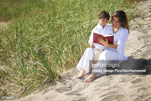 mother and son reading - design pics don hammond stock-fotos und bilder