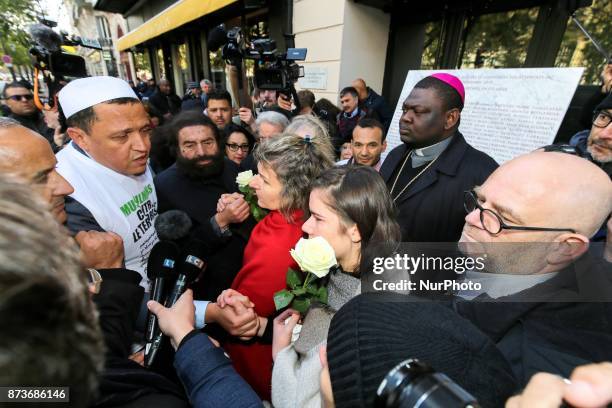 Imam of Drancy, Hassen Chalghoumi , French writer Marek Halter and other members of religious communities speak together and with other people in...