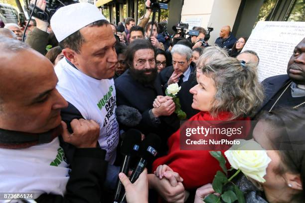 Imam of Drancy, Hassen Chalghoumi , French writer Marek Halter and other members of religious communities speak together and with other people in...