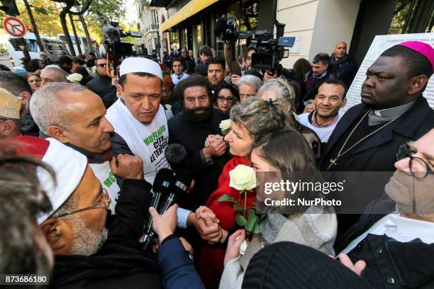 Imam of Drancy, Hassen Chalghoumi , French writer Marek Halter and other members of religious communities speak together and with other people in...