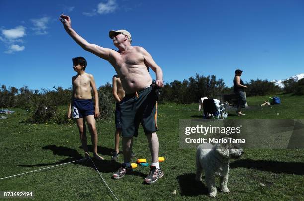 Ushuaians play tejo on a day which hit a daily record high of 66 degrees Farenheit on November 6, 2017 in Ushuaia, Argentina. Ushuaia is situated...