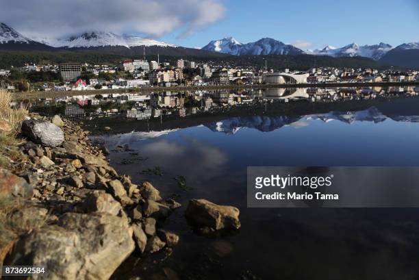 Ushuaia is reflected near the main docks on November 5, 2017 in Ushuaia, Argentina. Ushuaia is situated along the southern edge of Tierra del Fuego,...