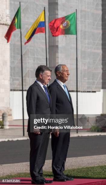 Portuguese President Marcelo Rebelo de Sousa and the President of Colombia Juan Manuel Santos Calderon listen to national anthems outside Jeronimos...
