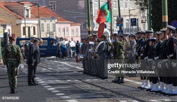 Portuguese President Marcelo Rebelo de Sousa and the President of Colombia Juan Manuel Santos Calderon salute the flag while reviewing the Armed...