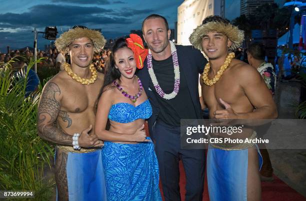 Alex O'Loughlin poses for pictures on the red carpet at the eighth annual Sunset on the Beach event, where thousands of Oahu residents and visitors...