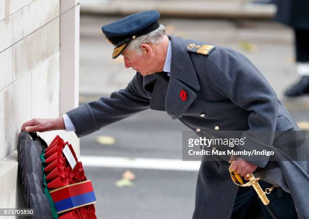 Prince Charles, Prince of Wales lays a wreath on behalf of Queen Elizabeth II during the annual Remembrance Sunday Service at The Cenotaph on...