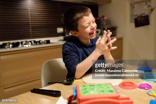 child (7 years) plays with salt dough - boys only caucasian ethnicity 6 7 years stock-fotos und bilder