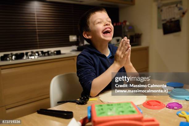 child (7 years) plays with salt dough - boys only caucasian ethnicity 6 7 years stock pictures, royalty-free photos & images
