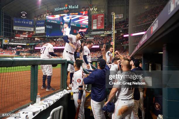 World Series: Houston Astros Carlos Correa victorious with Marwin Gonzalez in dugout during game vs Los Angeles Dodgers at Minute Maid Park. Game 5....