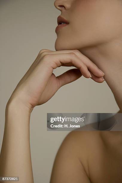 chin and hand of a woman - young women no clothes stock pictures, royalty-free photos & images