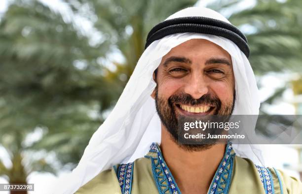 smiling middle eastern man - sunni islam stock pictures, royalty-free photos & images