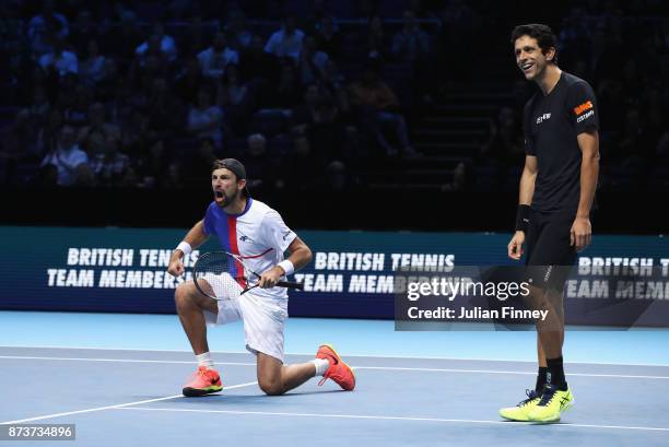 Lukasz Kubot of Poland and Marcelo Melo of Brazil celebrate victory in the Doubles match against Ivan Dodig of Croatia and Marcel Granollers of Spain...