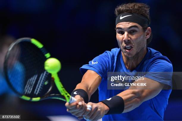 Spain's Rafael Nadal returns against Belgium's David Goffin during their singles match on day two of the ATP World Tour Finals tennis tournament at...