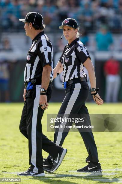 Down Judge Sarah Thomas talks with NFL Side Judge Scott Edwards during the game between the Los Angeles Chargers and the Jacksonville Jaguars on...