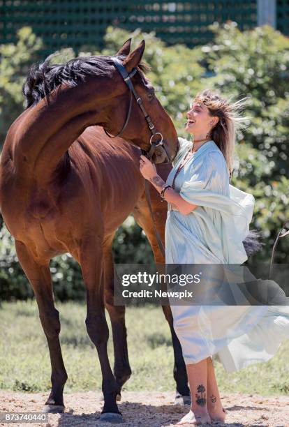 Paris Jackson poses with 2017 Melbourne Cup runner 'Marmelo' during a media call in Melbourne, Victoria.