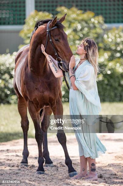 Paris Jackson poses with 2017 Melbourne Cup runner 'Marmelo' during a media call in Melbourne, Victoria.