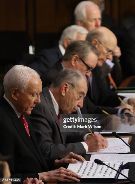 Chairman Orrin Hatch , is flanked by Senate Republicans while speaking during a Senate Finance Committee markup of the Tax Cuts and Jobs Act...