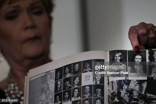 Beverly Young Nelson points to a picture of herself in her high school yearbook speaks to the media with her lawyer Gloria Allred, at a news...