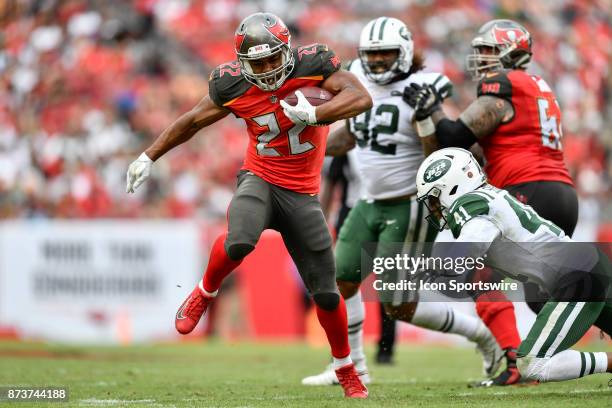 Tampa Bay Buccaneers running back Doug Martin tries to leap over the tackle by New York Jets cornerback Buster Skrine during the second half of an...