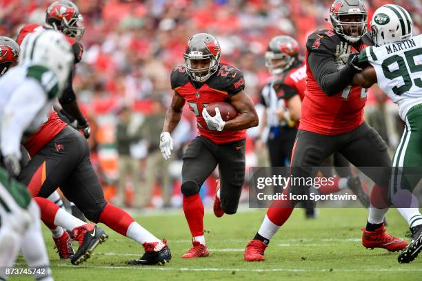 Tampa Bay Buccaneers running back Doug Martin runs up the middle during the first half of an NFL game between the New York Jets and the Tampa Bay...