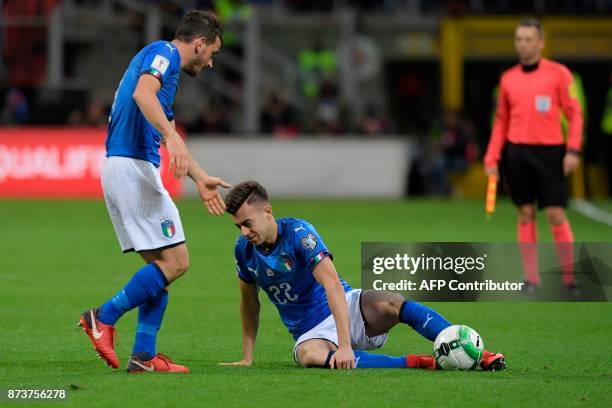 Italy's midfielder Stephan El Shaarawy reacts next to Italy's midfielder Alessandro Florenzi during the FIFA World Cup 2018 qualification football...