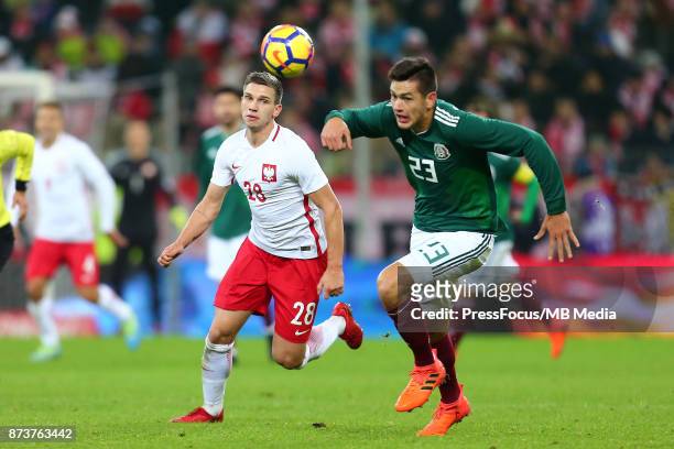 Jakub Swierczok of Poland in action with Cesar Montes of Mexico during the international friendly match between Poland and Mexico on November 13,...