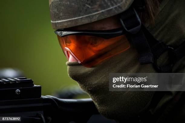 Portrait of a masked soldier at the gun. Shot during an exercise of the land forces on October 13, 2017 in Munster, Germany.